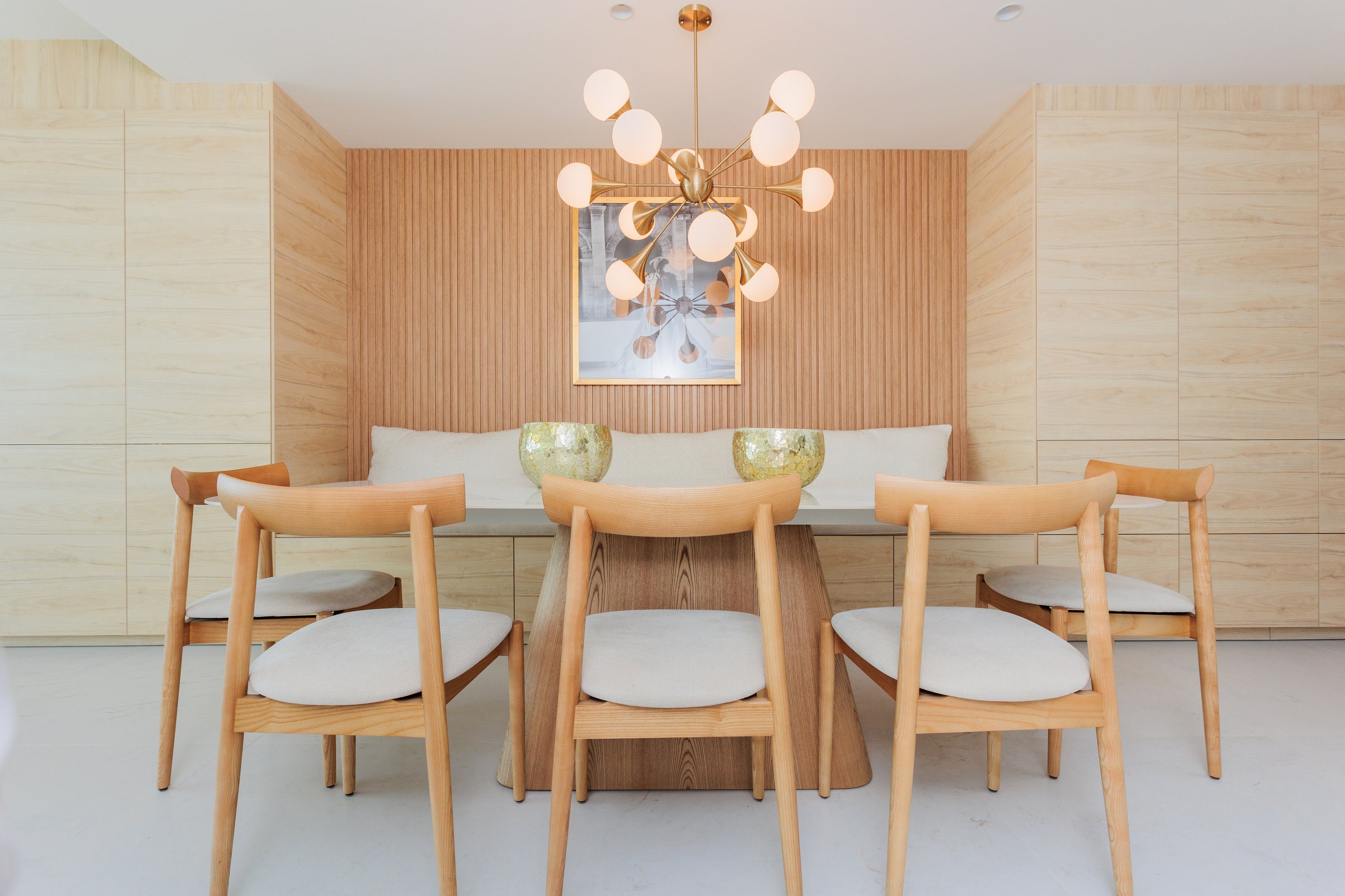 luxury interior design for dining room with wooden dining table, wooden dining chairs, decors, stylish ceiling lamp available in marbella, malaga, estepona, costa del sol.