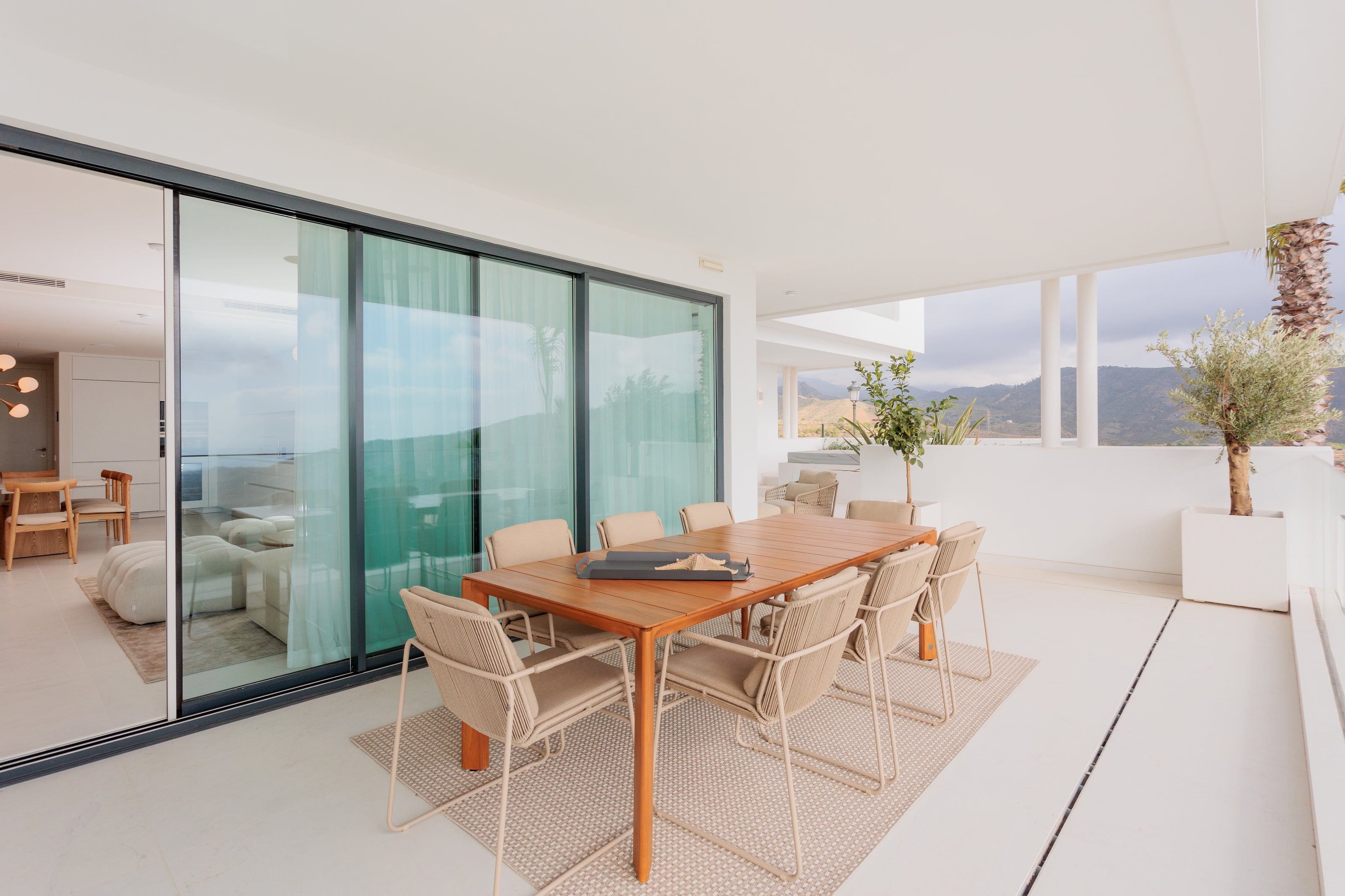 outdoor dining area, modern style, made of wood, aluminium beige, rug, clean white space interior, exterior design available in alcazaba, marbella, malaga, costa del sol.