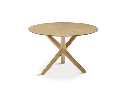 circular wooden dining table with crossed legs in oak wood available in bel air, gibraltar, marbella, malaga.