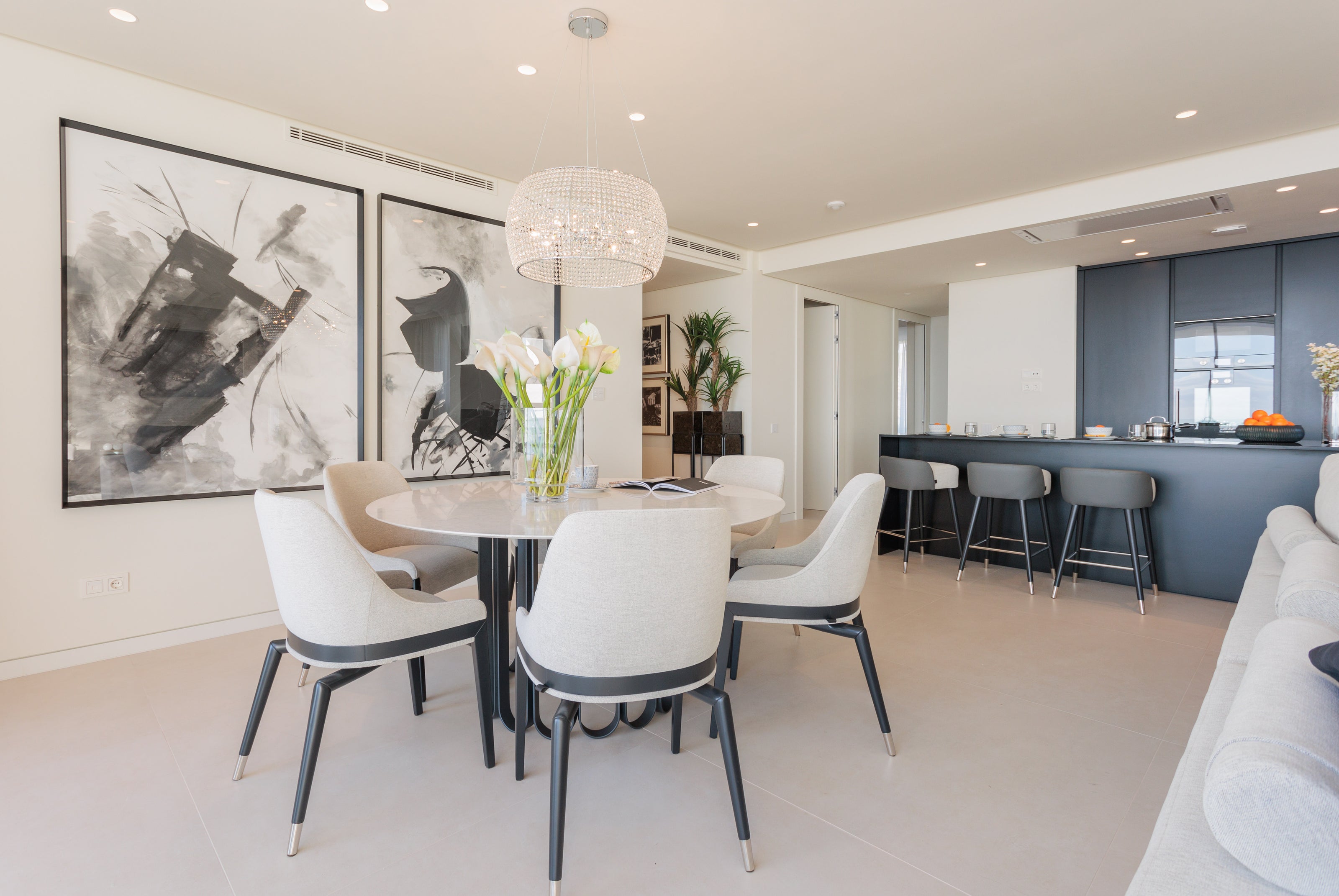 dining room interior design modern, with dining table and classic beige dining chairs, and chandelier available in casares, malaga, marbella, calahonda.