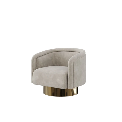 A modern barrel-style accent chair upholstered in light beige velvet, featuring a curved backrest and seat, supported by a polished gold metallic cylindrical base, set against a plain light gray background.